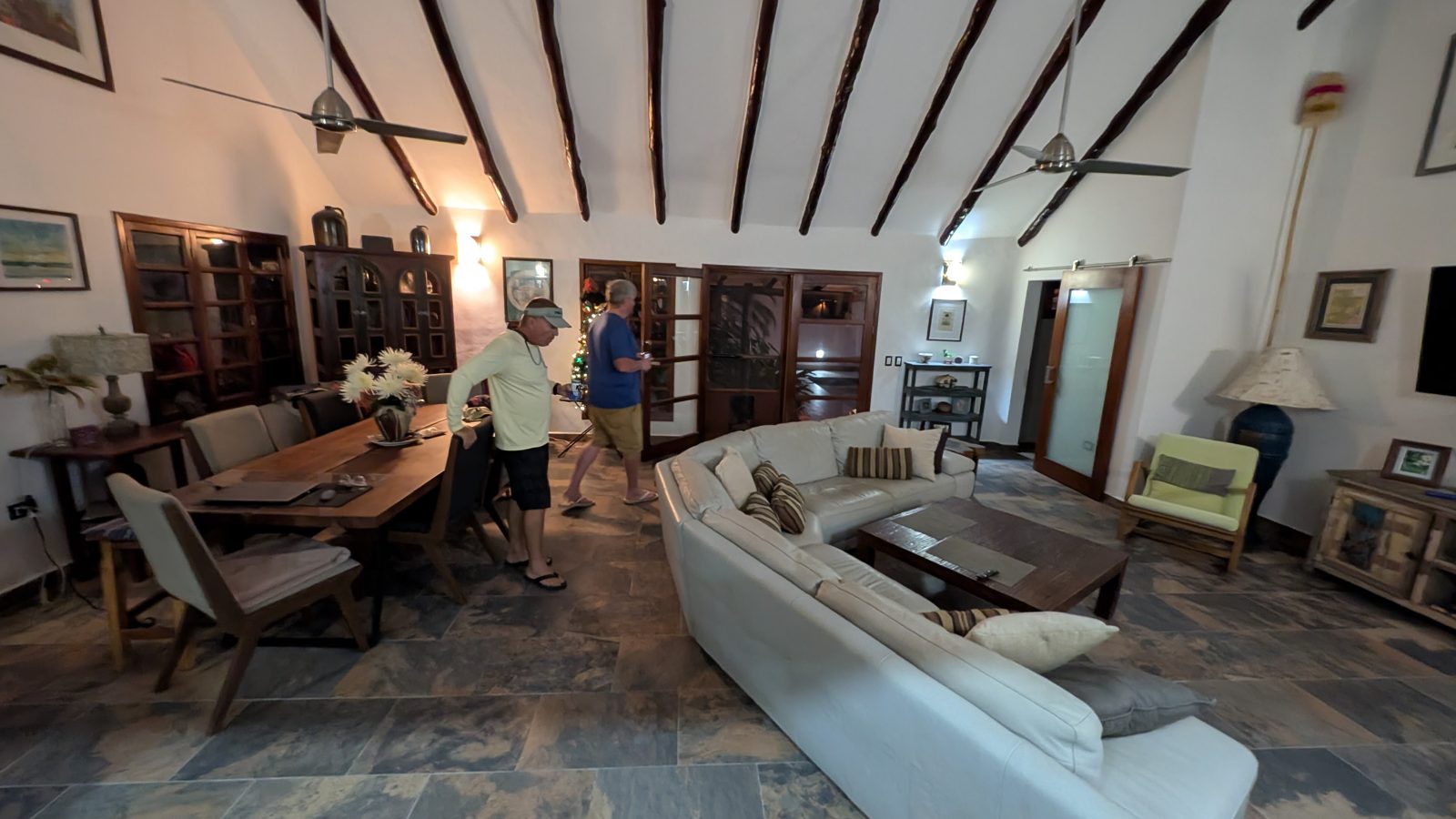 The open living room with tropical-hardwood beams and a vaulted ceiling